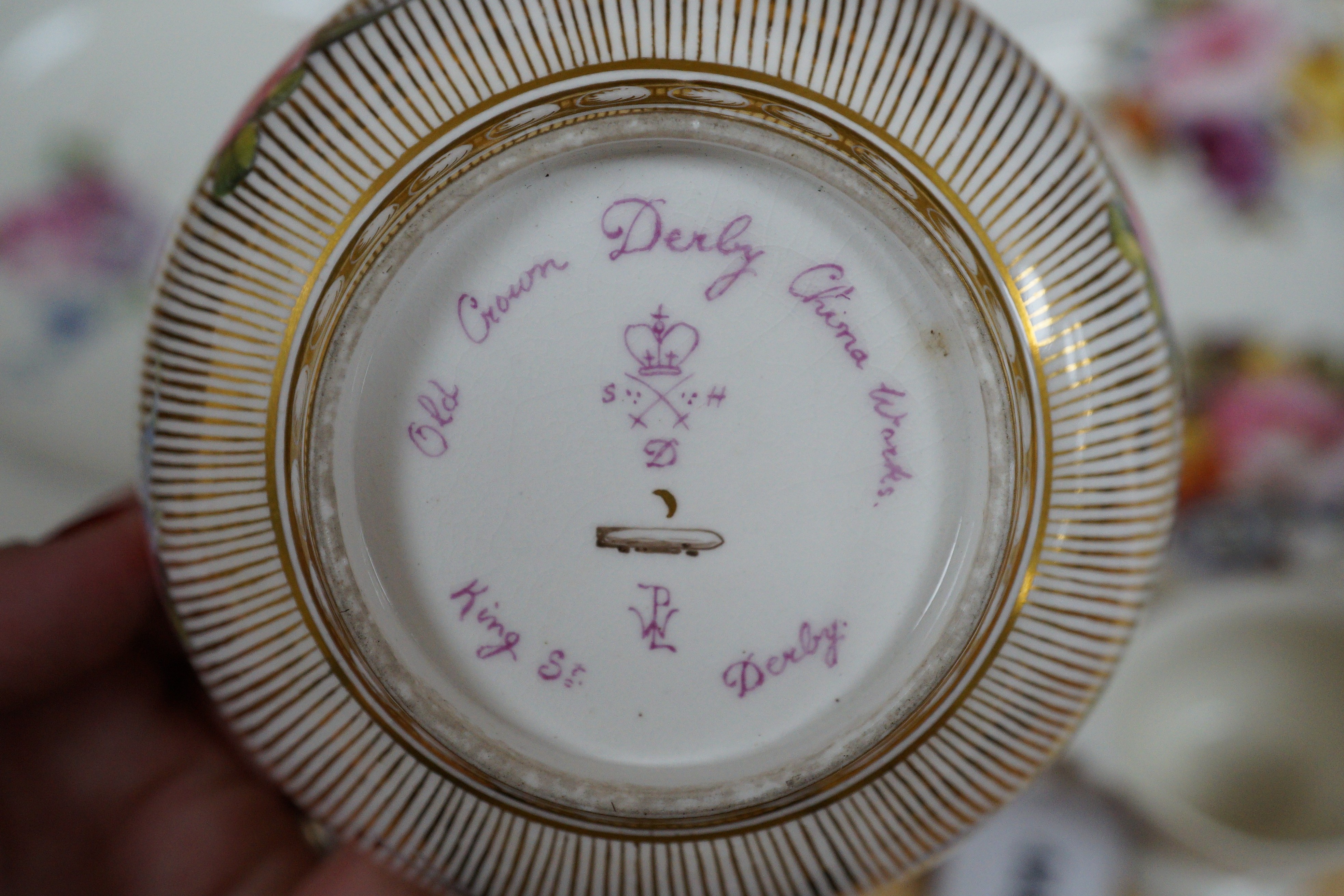 A Sampson Hancock Derby inkwell and cover, a similar coffee can, saucer and slop bowl, chantilly plate with basket-work border and four other items